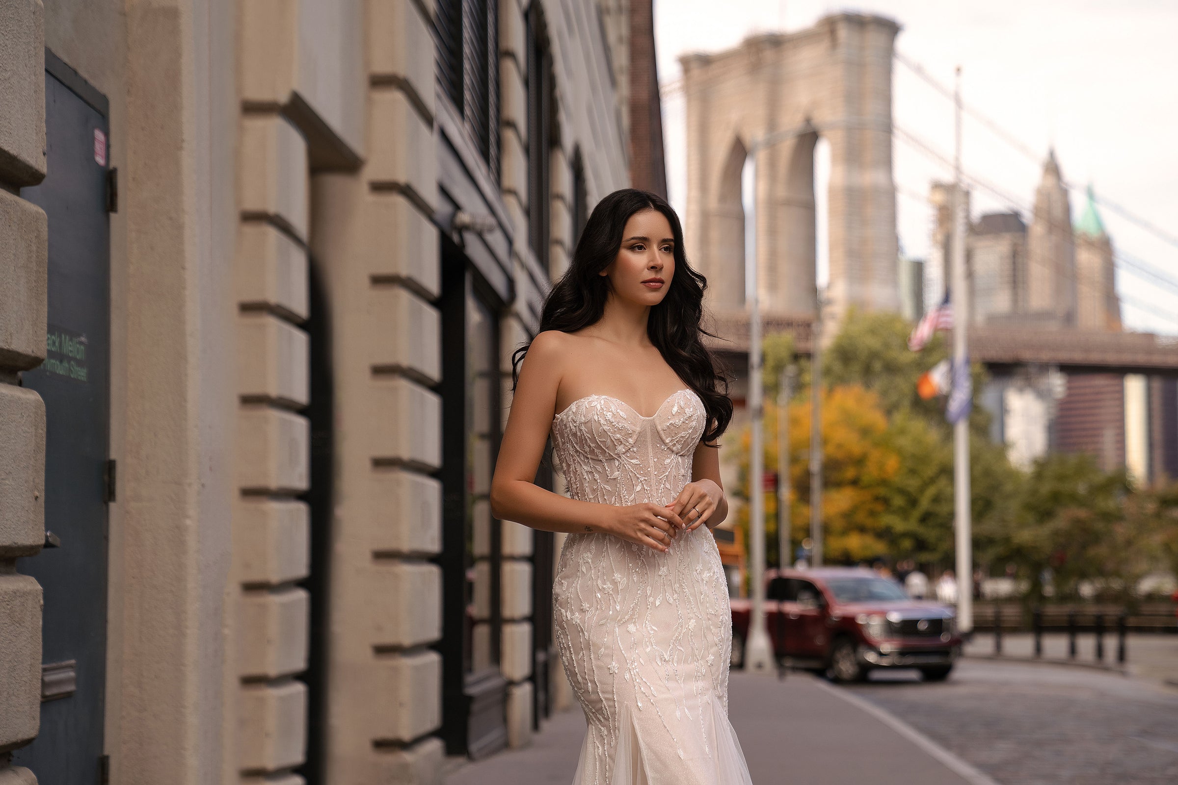 Strapless sweetheart-neck wedding dress with dense beadwork and a fitted mermaid silhouette