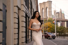 Strapless sweetheart-neck wedding dress with dense beadwork and a fitted mermaid silhouette