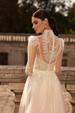 Close-up of an open illusion lace back and high neck on an ivory wedding dress
