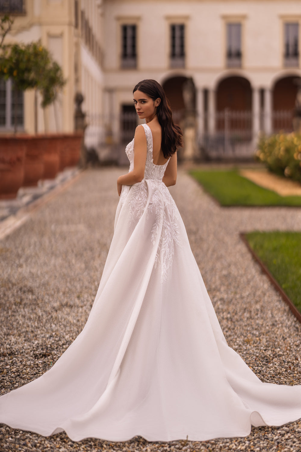 Elegant A-Line Wedding Gown with V-Neck, Straps, Slit Skirt, Lace, and Train