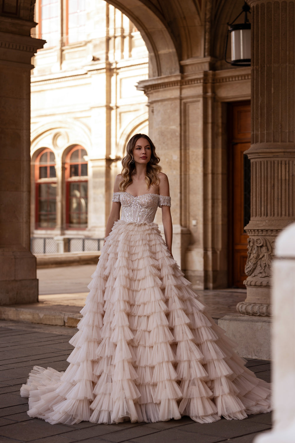 Ball Gown Wedding Dress With Off-The-Shoulder Neckline Tiered Tulle Skirt Beading And Crystals Cathedral Train