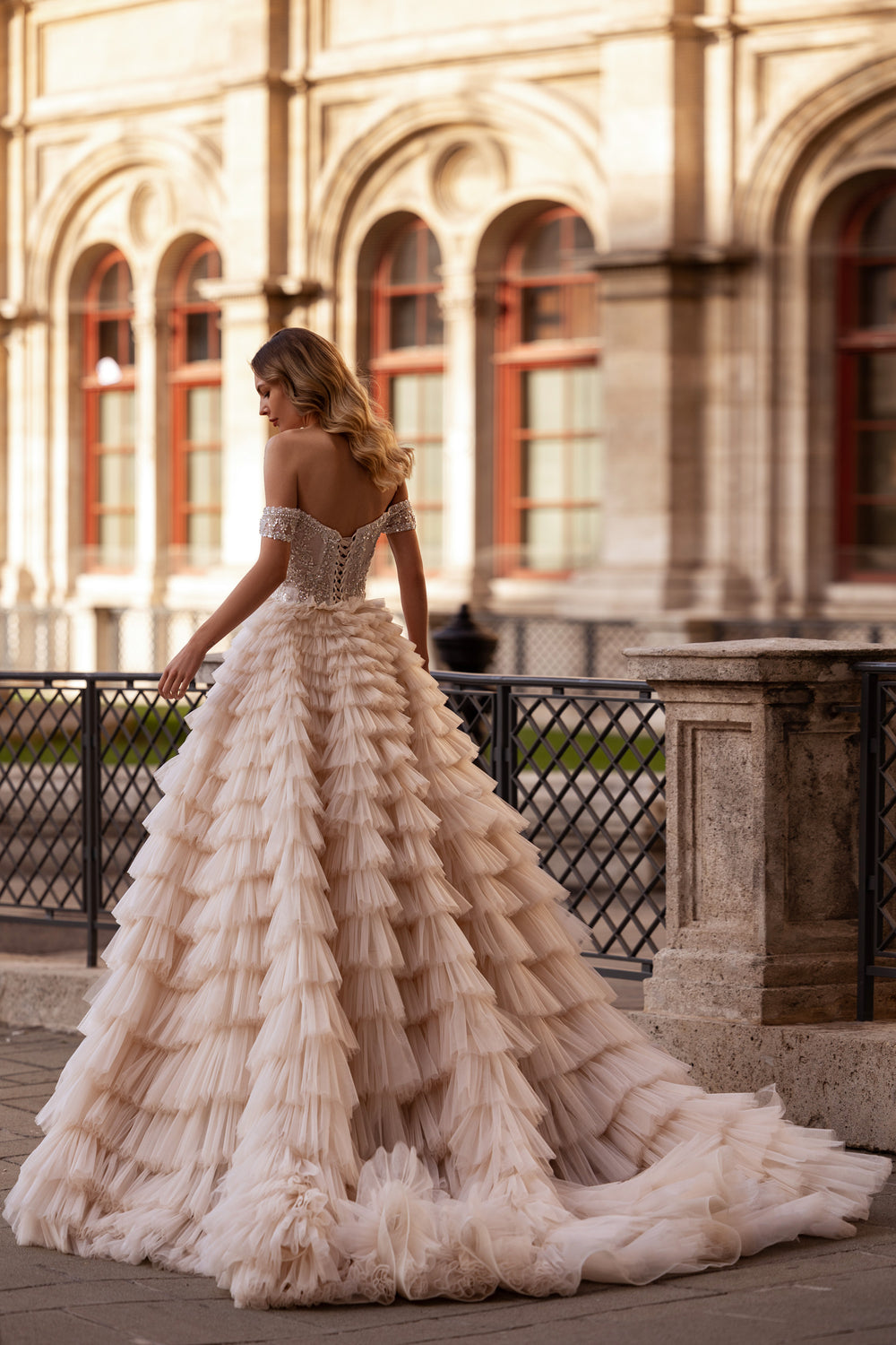 Ball Gown Wedding Dress With Off-The-Shoulder Neckline Tiered Tulle Skirt Beading And Crystals Cathedral Train