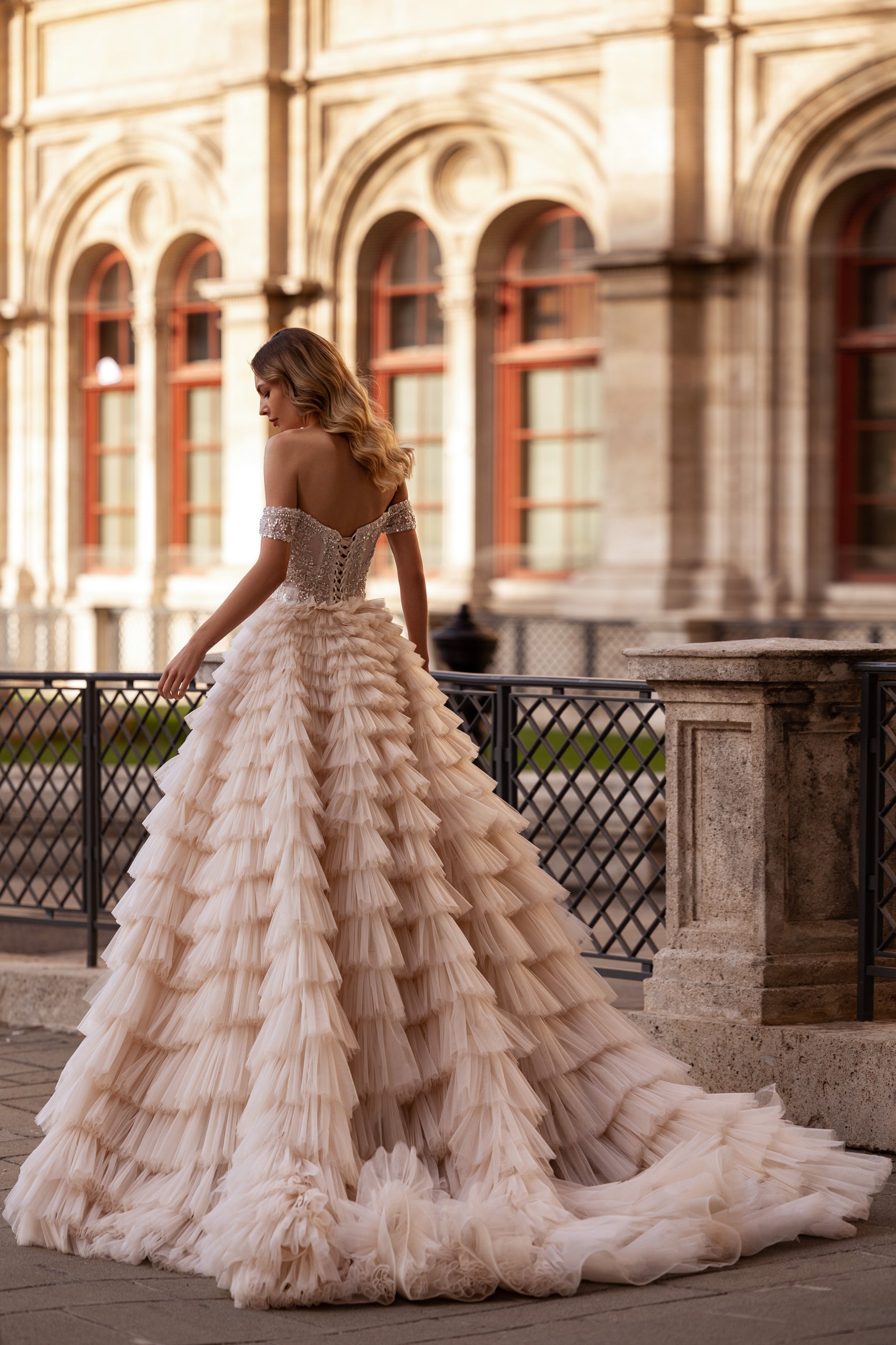 Ball Gown Wedding Dress With Off-The-Shoulder Neckline Tiered Tulle Skirt Beading And Crystals Cathedral Train