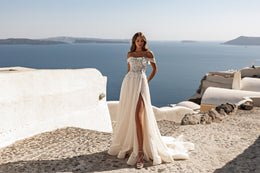 Off-the-shoulder ivory wedding dress with a beaded bodice, A-line skirt, and high front slit