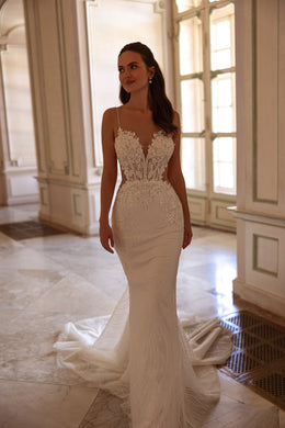 Ivory mermaid wedding dress with a plunging V-neck, beaded floral lace bodice, thin straps, and train