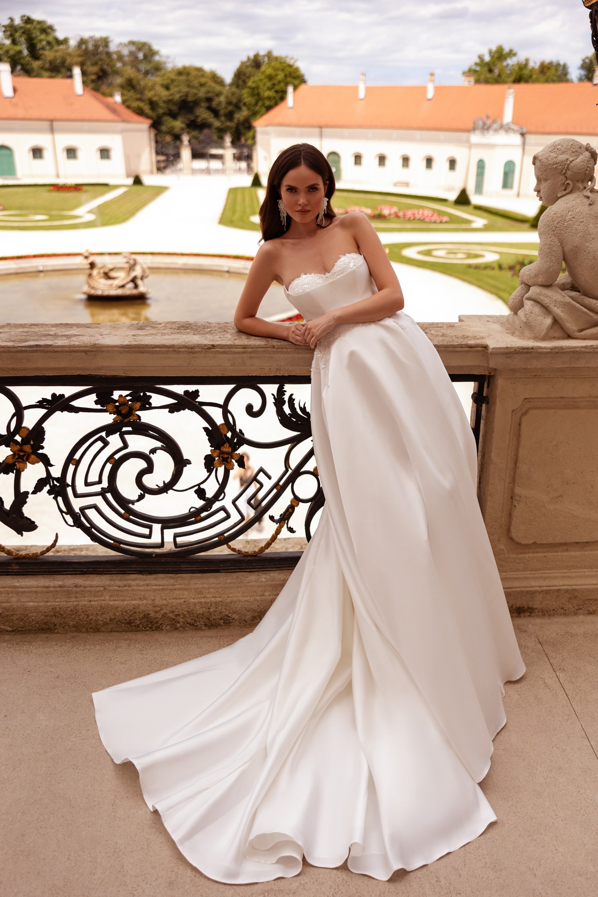 Ivory strapless wedding dress featuring a beaded sweetheart neckline and a smooth, full-length skirt
