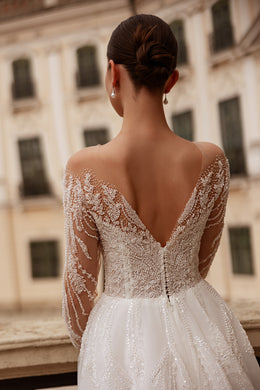 Deep V-back wedding dress with sparkling lace sleeves, beaded embroidery, and covered back buttons
