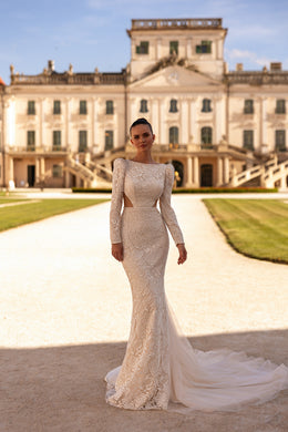 Ivory lace mermaid wedding dress with long sleeves, fitted bodice, and flowing tulle train