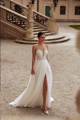 Ivory A-line wedding dress with floral lace bodice, spaghetti straps, thigh-high slit, and train