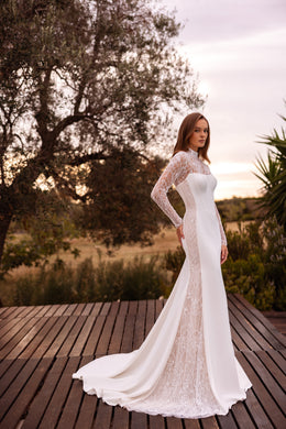 Ivory sheath wedding dress with fitted floral lace long sleeves, a square neckline, and lace train