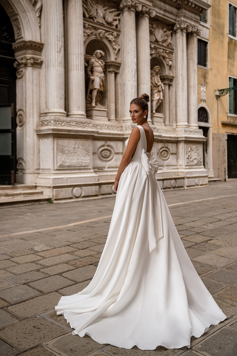 Ball Gown Wedding Dress with Deep V-Neck and Statement Bow