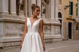 Ball Gown Wedding Dress with Deep V-Neck and Statement Bow