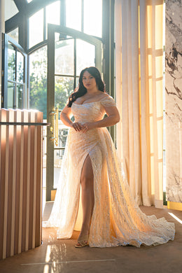 Champagne off-the-shoulder mermaid wedding dress with sparkling beadwork, thigh-high slit, and sweeping train