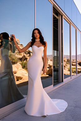 Strapless ivory mermaid wedding dress with a sweetheart neckline and a softly flared long train