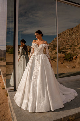 Ivory ball gown wedding dress with a sweetheart neckline, off-the-shoulder lace sleeves, and long train