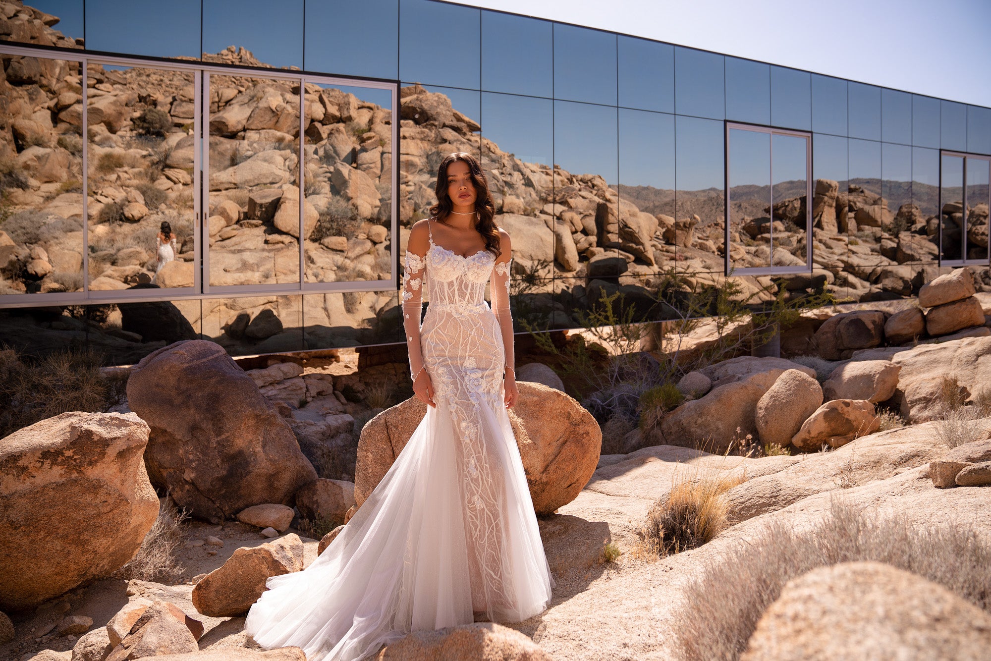 Ivory mermaid wedding dress with a sweetheart neckline, fitted lace bodice, and sweeping train
