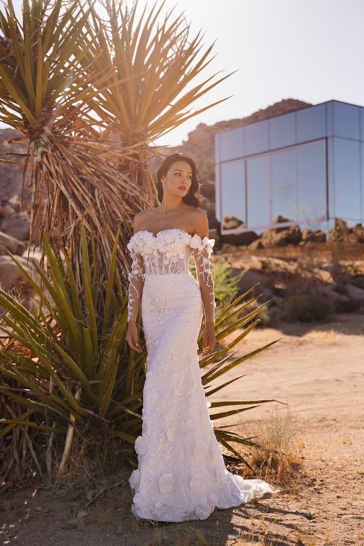 Ivory mermaid wedding dress with off-the-shoulder floral lace sleeves and a long scalloped train