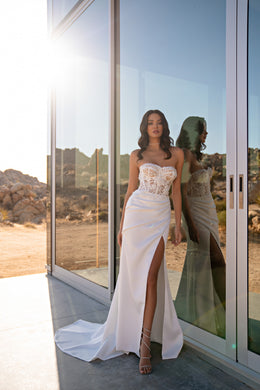 Strapless ivory wedding dress with a sweetheart lace bodice, ruched skirt, high slit, and train