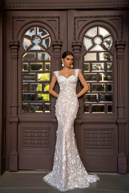 Ivory floral lace wedding dress with cap sleeves, a V-neckline, fitted sheath silhouette, and sweeping train
