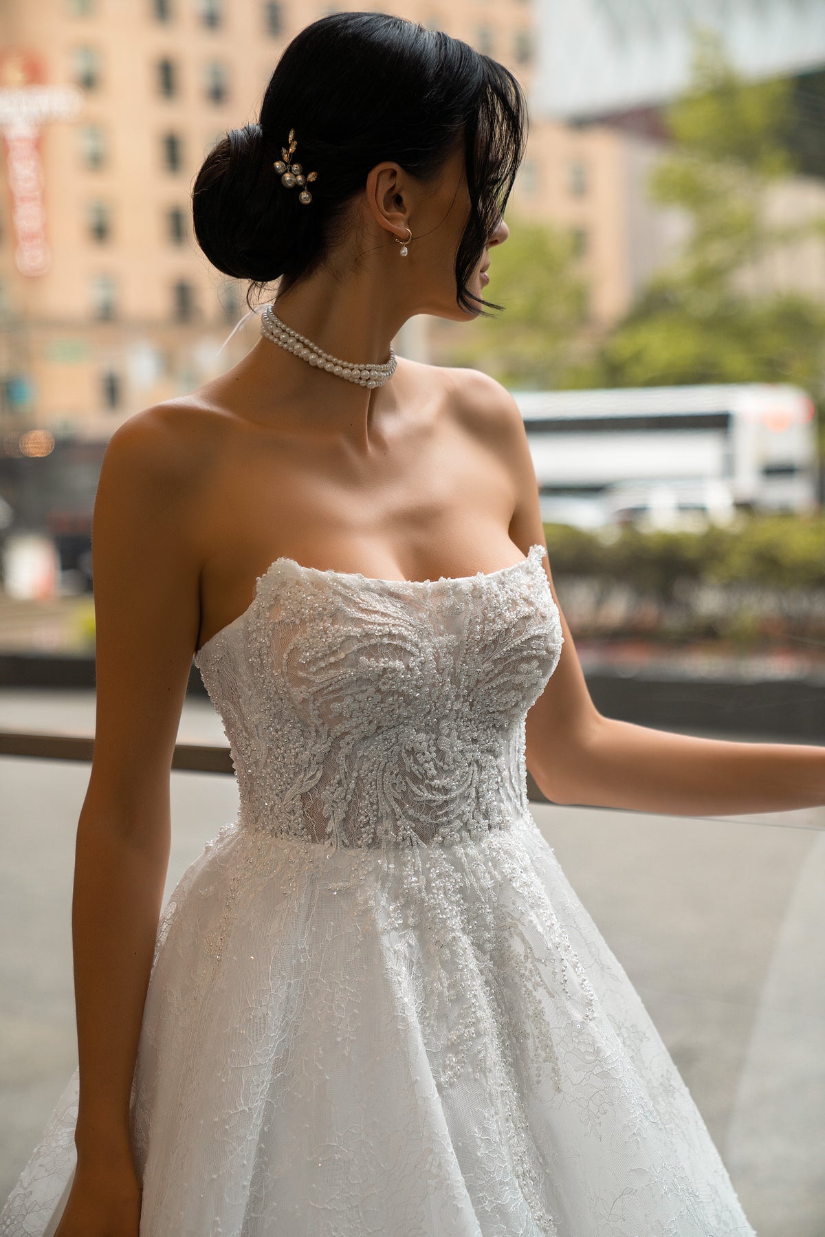 Close-up of the strapless sweetheart neckline and intricate beaded lace bodice on a wedding dress