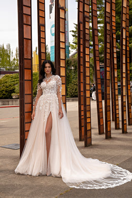 Ivory A-line wedding dress with floral lace sleeves, a thigh-high slit, and a long train