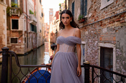 Off-shoulder lavender evening dress with a structured beaded waist and softly gathered full skirt