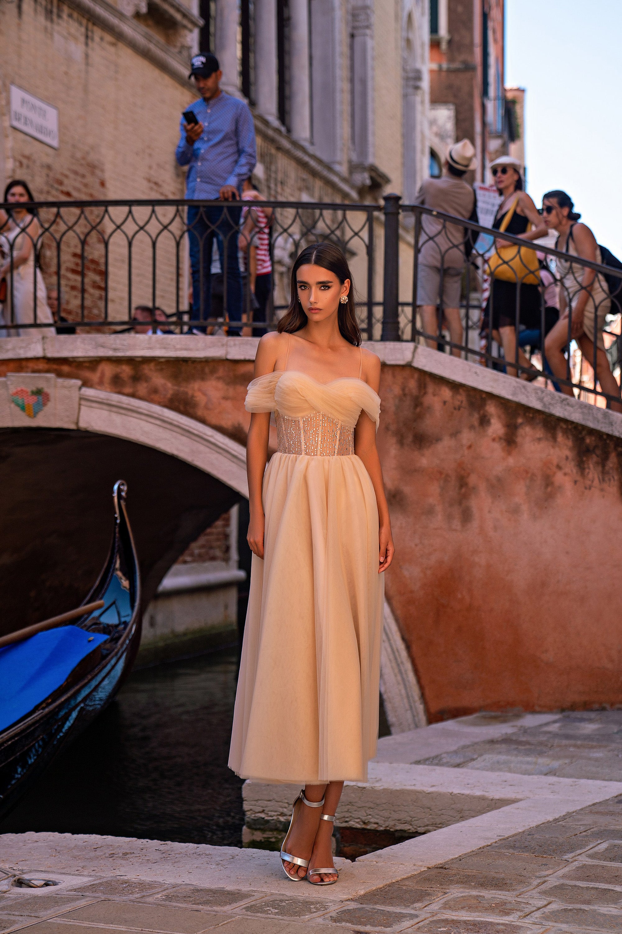 Champagne evening dress with a beaded fitted bodice, thin straps, and a full ankle-length skirt