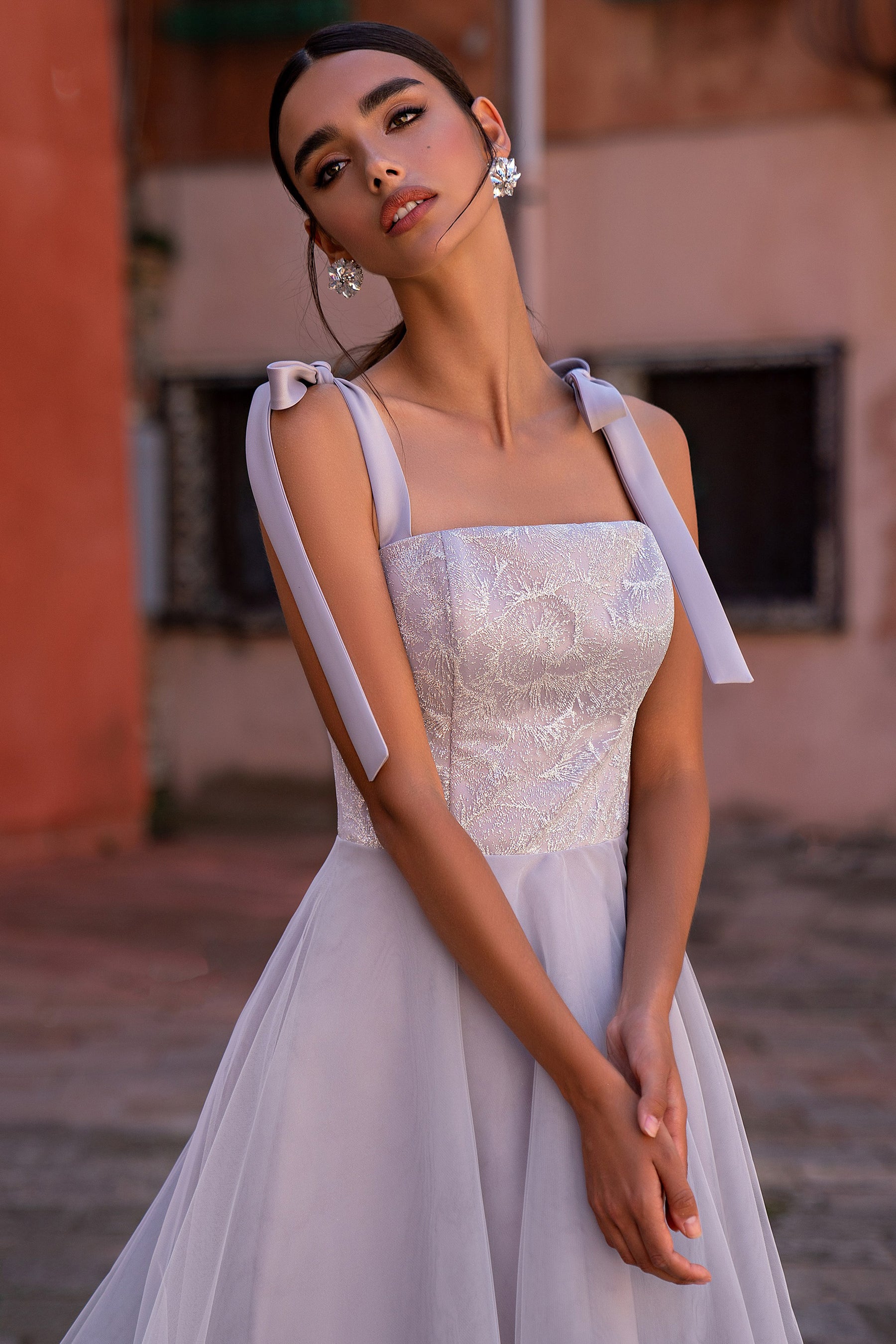 Sparkling square-bodice evening dress with tied shoulder ribbons and a softly gathered ivory tulle skirt