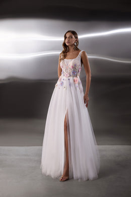 White evening dress with colorful floral embroidery, sleeveless scoop neckline, full tulle skirt, and thigh-high slit