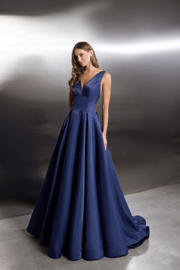Navy evening dress with a V-neck bodice, sleeveless design, and wide flowing ballgown skirt