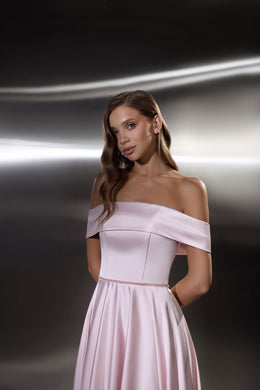 Blush pink evening dress with an off-the-shoulder neckline, fitted bodice, and flowing floor-length skirt
