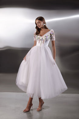 White evening dress with floral embroidered bodice, puff sleeves, square neckline, and full tulle skirt
