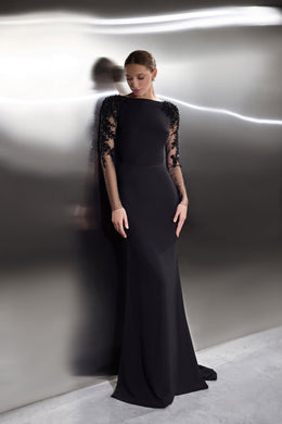Black evening dress with a floor-length column silhouette and sheer lace long sleeves
