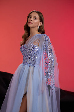 Close-up of a pale blue evening dress with a crystal-beaded bodice and sheer draped sleeves