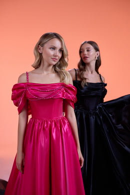 Pink evening dress with thin straps, a draped off-the-shoulder neckline, and a gathered full skirt