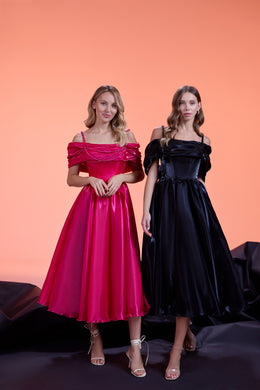 Full-length pink evening dress featuring a layered draped neckline, fitted bodice, and flowing midi skirt