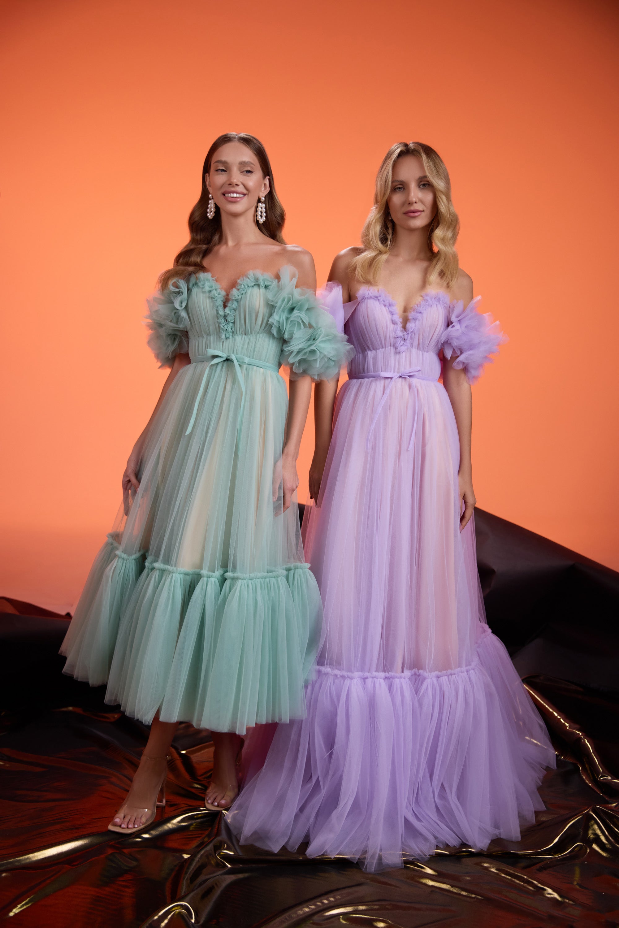 Lavender evening dress with a ruched bodice, puff sleeves, defined waist, and full tiered skirt