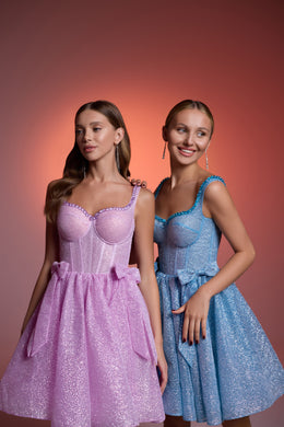 Pink and blue glitter evening dresses with scoop necklines, fitted bodices, bow waists, and flared skirts