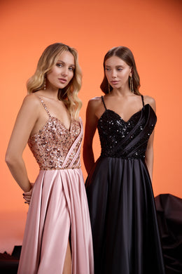 Close-up of a blush pink evening dress with a glittering sequined bodice and delicate spaghetti straps