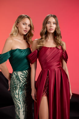 Burgundy evening dress with draped off-shoulder sleeves, crystal-sequin thigh slit, and flowing overskirt