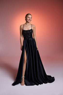 Black evening dress with a glittering bodice, thin straps, thigh-high slit, and sweeping floor-length train