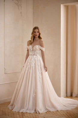 Ivory A-line wedding dress with an off-the-shoulder neckline, floral lace appliqués, and a sweeping train