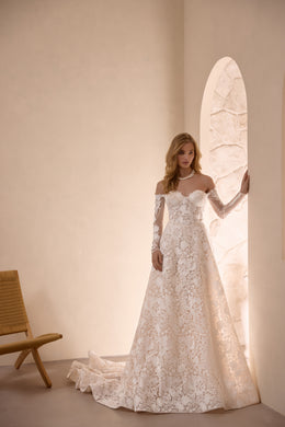 Ivory A-line wedding dress with floral lace, off-the-shoulder neckline, long sleeves, and a train