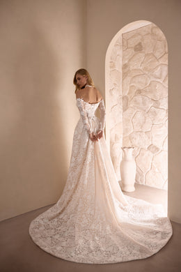Ivory floral lace wedding dress with a fitted back and broad lace-trimmed train