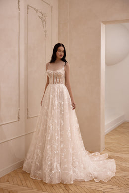 Ivory A-line wedding dress with a square neckline, thin straps, corset bodice, floral lace, and chapel train