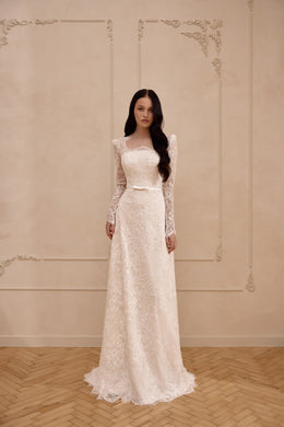 Ivory lace sheath wedding dress with long sleeves, a square neckline, fitted waist, and floor-length train