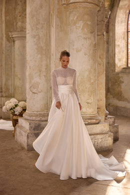 Ivory A-line wedding dress with a beaded high neckline, sheer long sleeves, and sweeping train