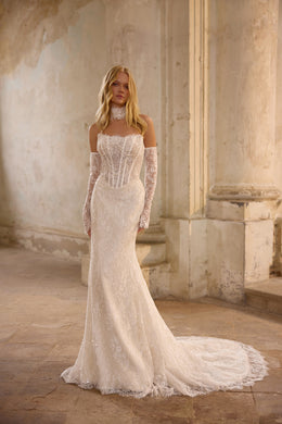 Ivory mermaid wedding dress with a beaded corset, lace off-the-shoulder sleeves, and sweeping train