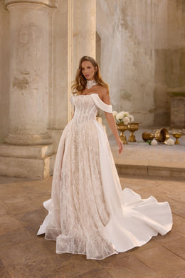 Ivory A-line wedding dress with floral lace overlay, off-shoulder sleeves, and a smooth detachable overskirt