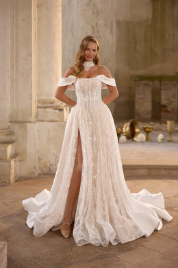 Ivory lace A-line wedding dress with an off-shoulder neckline, high slit, and flowing overskirt panels